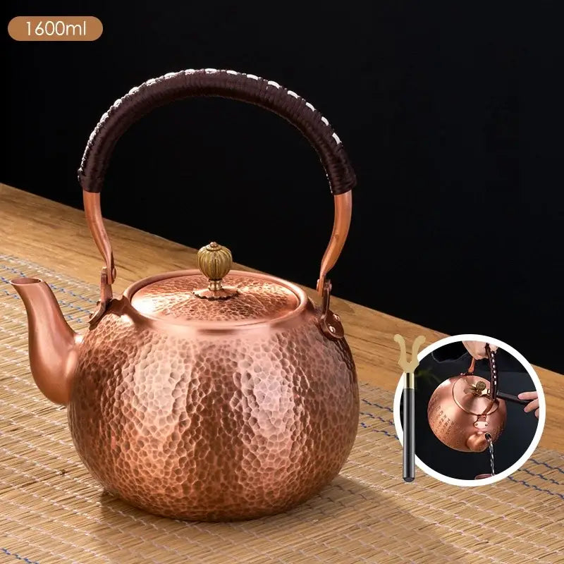 Handmade hammered copper tea pot with knitting handle dining room set