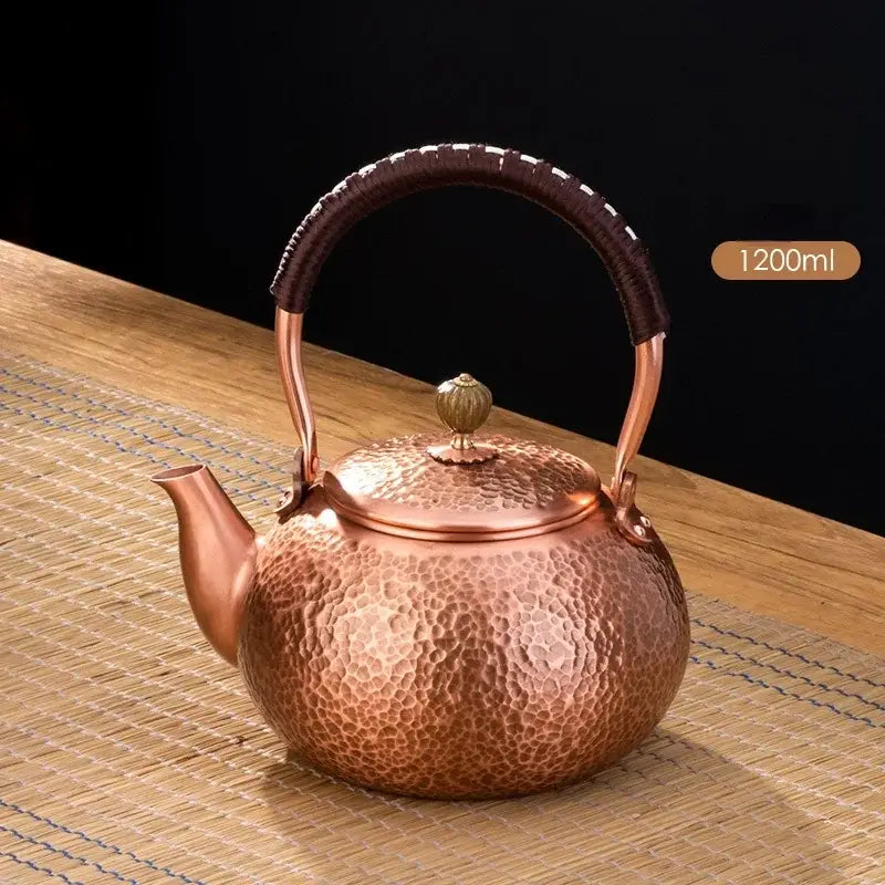 Handmade hammered copper tea pot with knitting handle dining room set