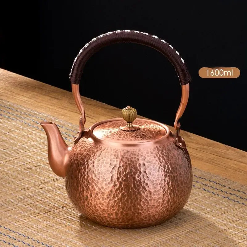 Handmade hammered copper tea pot with knitting handle dining room set