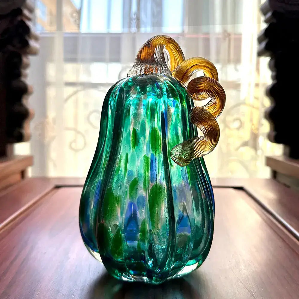 Handmade iridescent teal & green glass pumpkin figurines living room