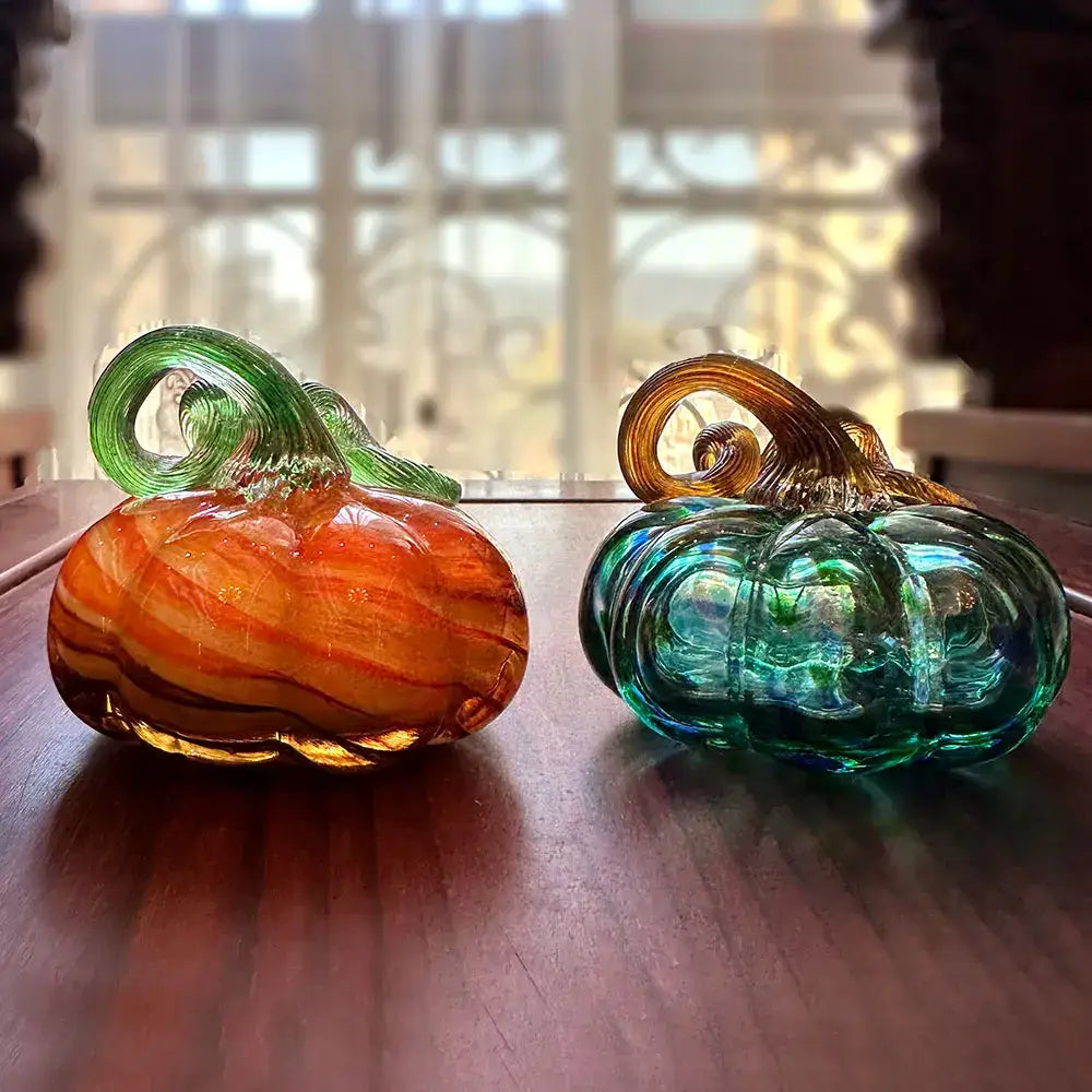 Handmade iridescent teal & green glass pumpkin figurines living room
