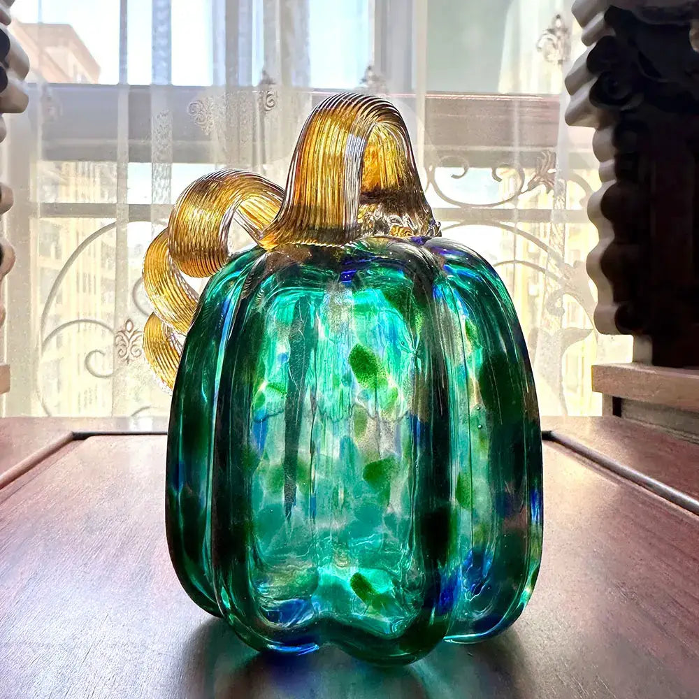 Handmade iridescent teal & green glass pumpkin figurines living room