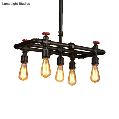 Industrial black pipe hanging ceiling light – dining room red accents
