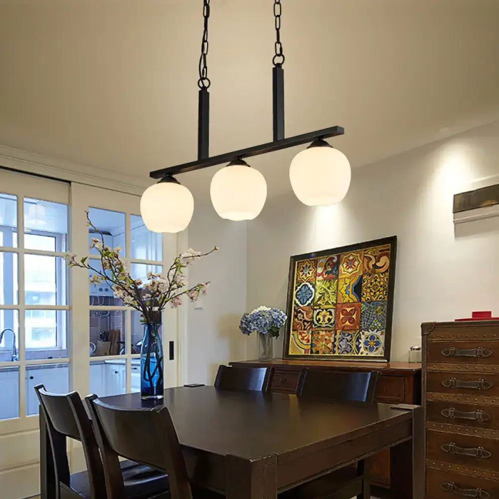 Industrial black 3-light opal glass globe pendant – dining room