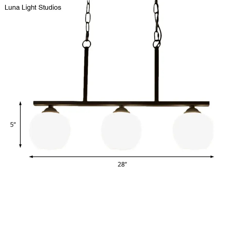 Industrial black 3-light opal glass globe pendant – dining room