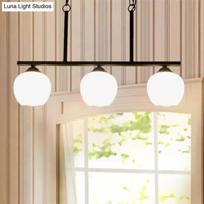 Industrial black 3-light opal glass globe pendant – dining room