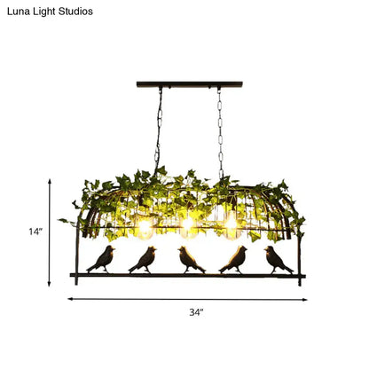 Industrial black birdcage kitchen pendant light with plant decoration
