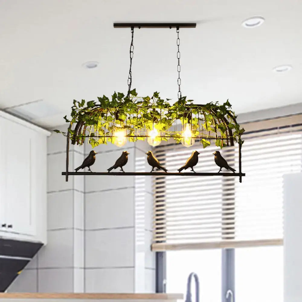 Industrial black birdcage kitchen pendant light with plant decoration
