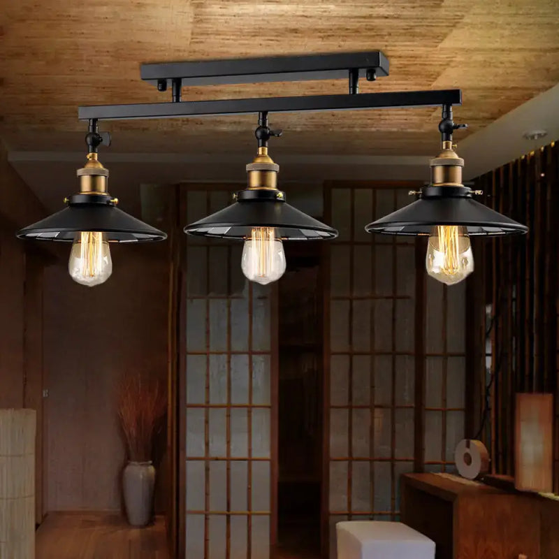 Industrial black metal and brass ceiling light fixture dining room