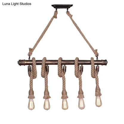 Industrial black pipe and rope chandelier for linear restaurant island