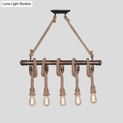 Industrial black pipe and rope chandelier for linear restaurant island