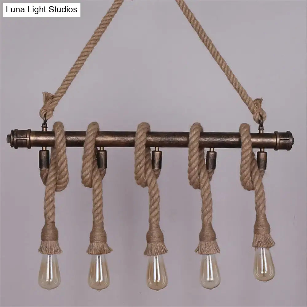 Industrial black pipe and rope chandelier for linear restaurant island