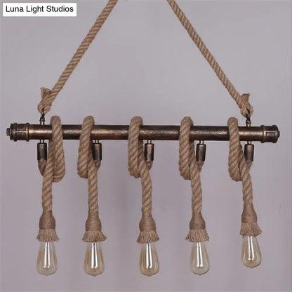 Industrial black pipe and rope chandelier for linear restaurant island