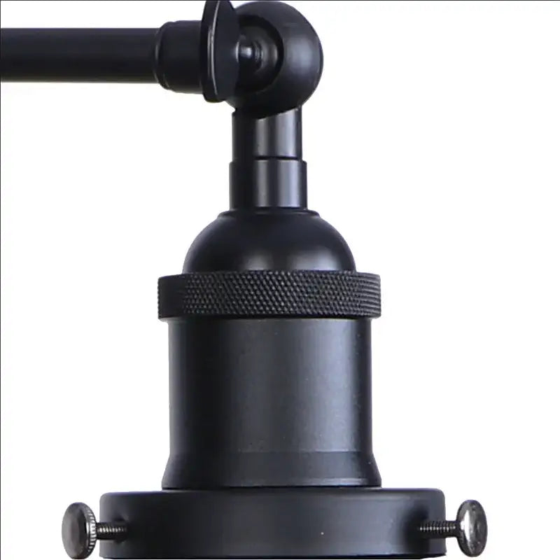 Industrial black swing arm wall light fixture with faceted glass shade