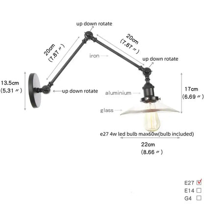 Industrial black swing arm wall light fixture with faceted glass shade
