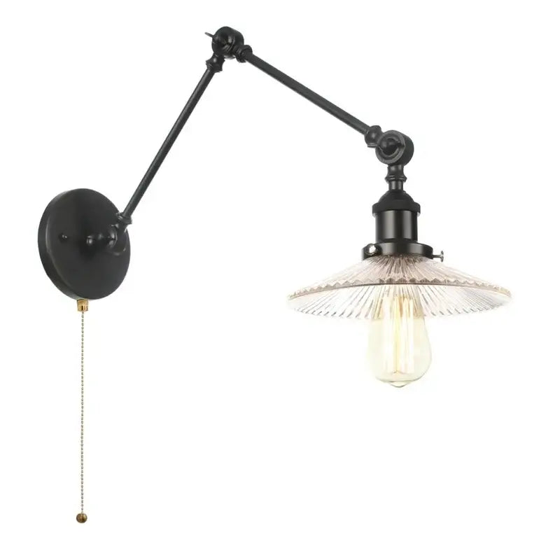 Industrial black swing arm wall light fixture with faceted glass shade