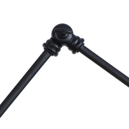 Industrial black swing arm wall light fixture with faceted glass shade
