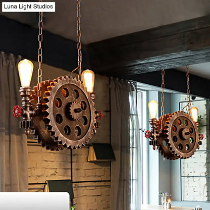 Industrial brass gear pendant light dining room with red accents