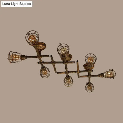 Industrial brass intersecting piping ceiling light dining room cage
