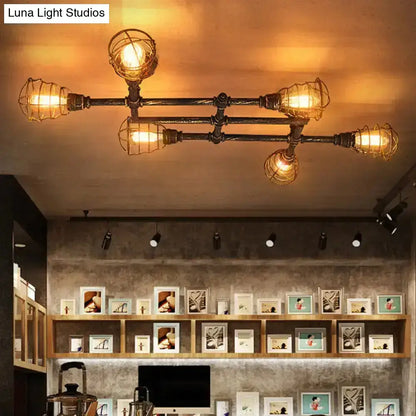Industrial brass intersecting piping ceiling light dining room cage