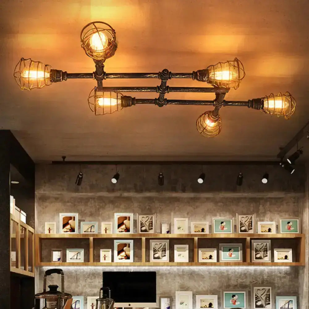 Industrial brass intersecting piping ceiling light dining room cage
