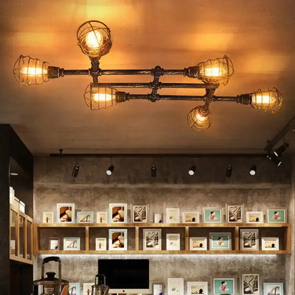 Industrial brass intersecting piping ceiling light dining room cage