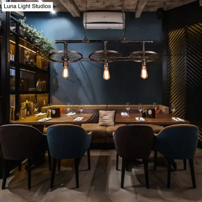 Industrial bronze wheel island pendant light with bare bulbs kitchen
