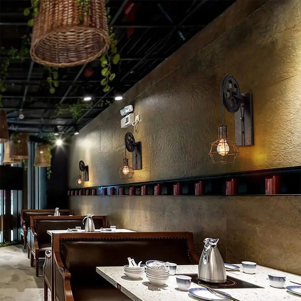 Industrial iron wall sconce with wooden pulley for cafe decor