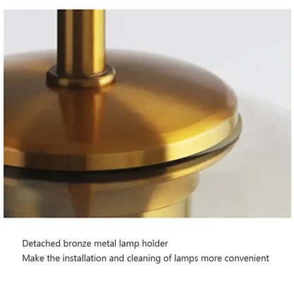 Industrial smoked glass and brass pendant light – dining room