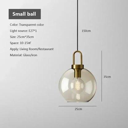Industrial smoked glass and brass pendant light – dining room