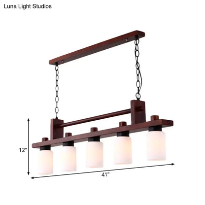 Traditional linear wood island pendant with opal glass dining room