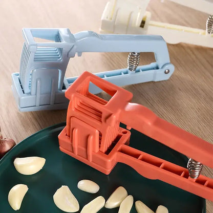 Light blue spring loaded garlic press slicer – kitchen tool