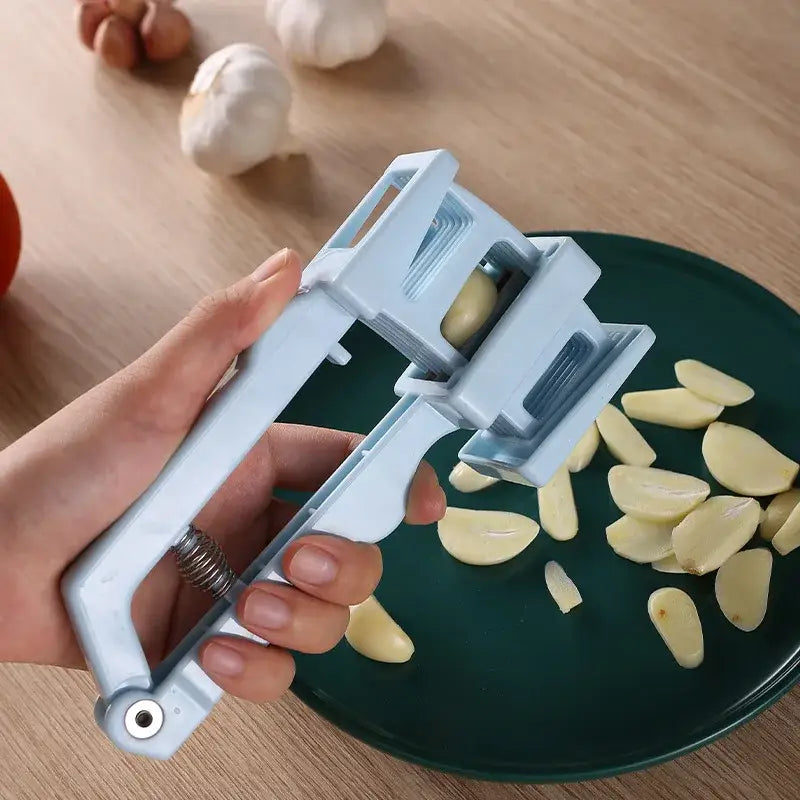 Light blue spring loaded garlic press slicer – kitchen tool