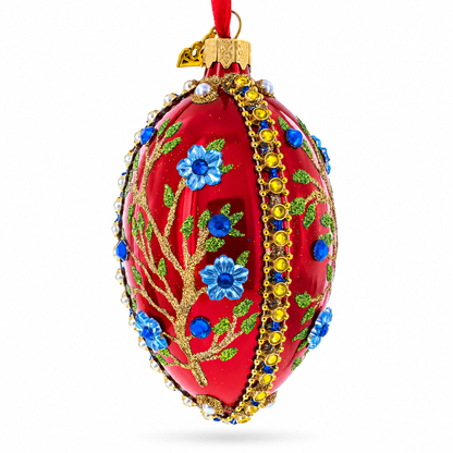 Blue Bejeweled Flowers on Red Glass Egg Ornament 4 Inches
