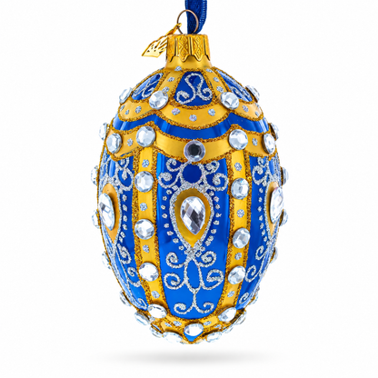White Scrolls on Blue Glass Egg Ornament 4 Inches