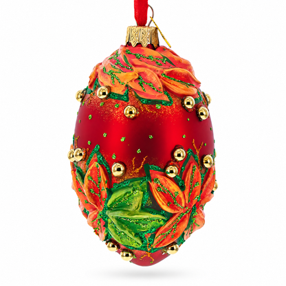 Red and Green Leaves on Red Glass Egg Ornament 4 Inches