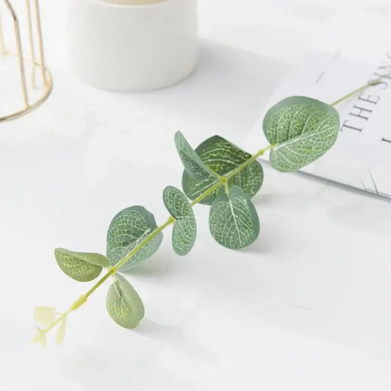 Lush artificial eucalyptus leaves garland with white flowers wedding decor