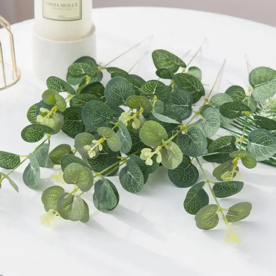 Lush artificial eucalyptus leaves garland with white flowers wedding decor