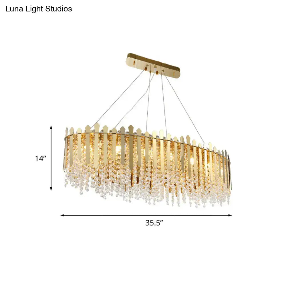 Luxurious gold elliptical island light fixture with clear crystal dining room
