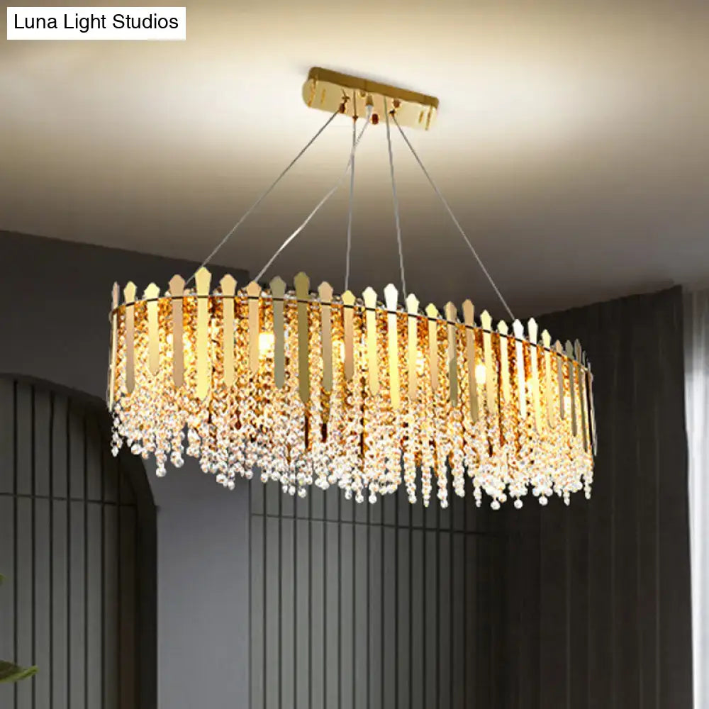 Luxurious gold elliptical island light fixture with clear crystal dining room