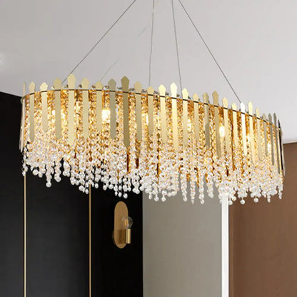 Luxurious gold elliptical island light fixture with clear crystal dining room
