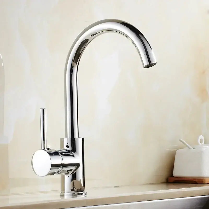 Matte black brass kitchen faucet with curved swivel spout