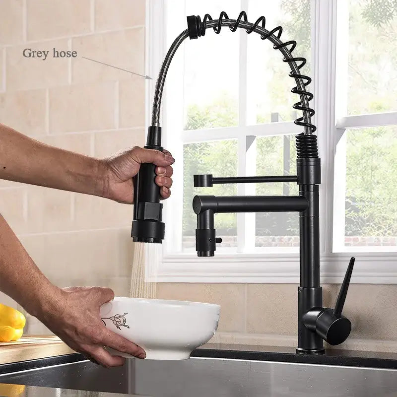 Matte black brass kitchen faucet with swivel spout