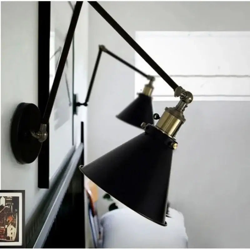 Matte black umbrella wall lights with brass accents – living room