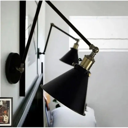 Matte black umbrella wall lights with brass accents – living room
