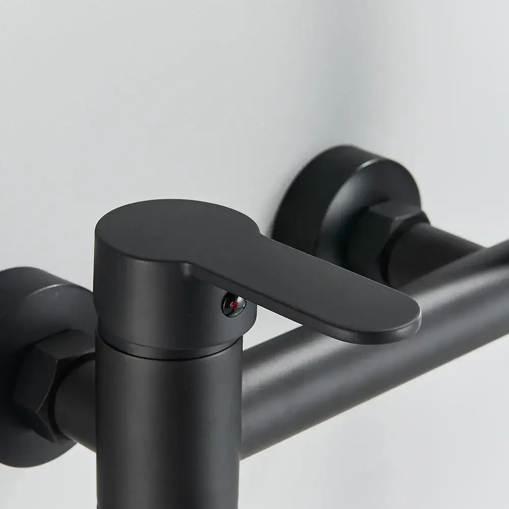 Matte black wall mounted waterfall bathtub faucet with handheld spray