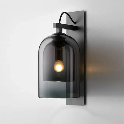 Mid-century black wall sconce with smoked dome glass shade living room