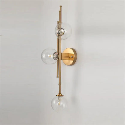 Mid century brass finish 3 light clear glass orb sconce living room