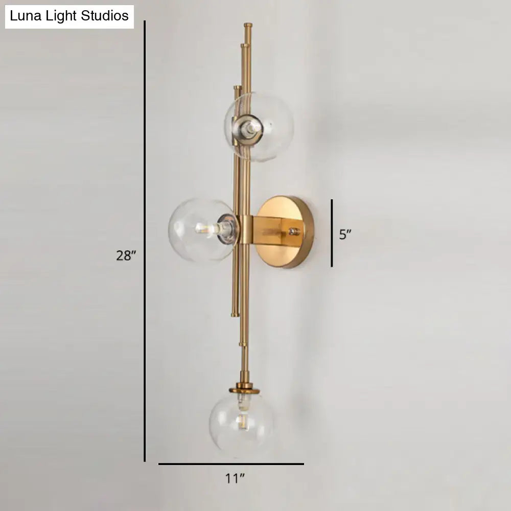Mid century brass finish 3 light clear glass orb sconce living room