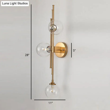 Mid century brass finish 3 light clear glass orb sconce living room